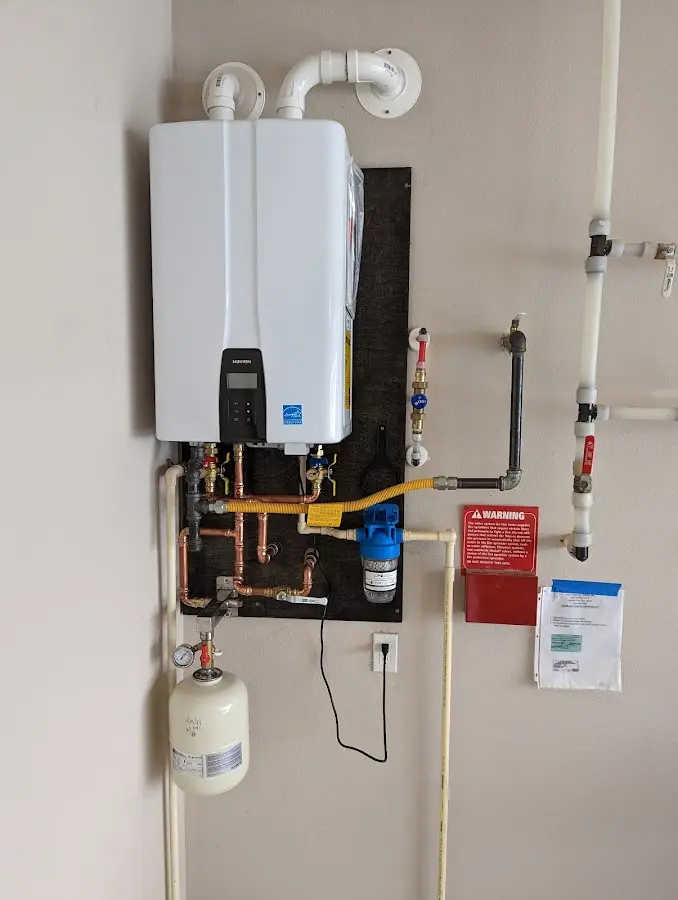 Professional plumber installing copper piping in a Jessup home